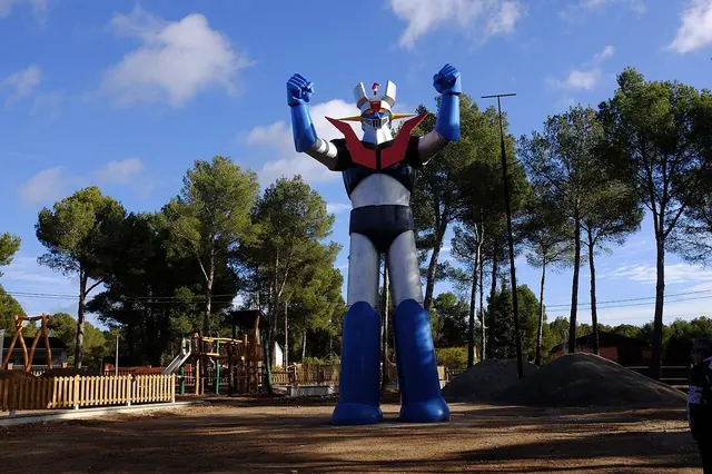 Die-cast super robot figure standing on a shelf